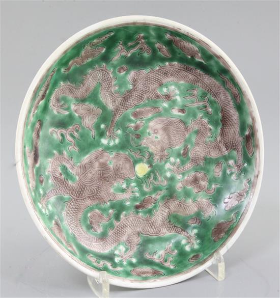A Chinese Susancai dragon saucer dish, Kangxi mark and of the period (1662-1722), diameter 19.2cm, restored